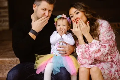 Grant Burchfield with his wife and daughter